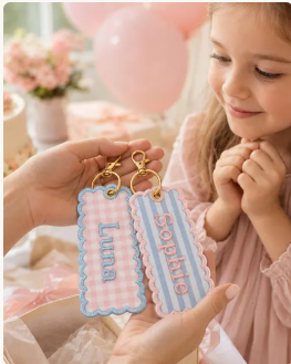 Pastel scalloped personalised name tags held in a lifestyle photo